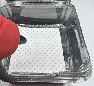 Food-ahesive-Securing-moisture-absorbent-pads-in-food-packaging HydraSorb